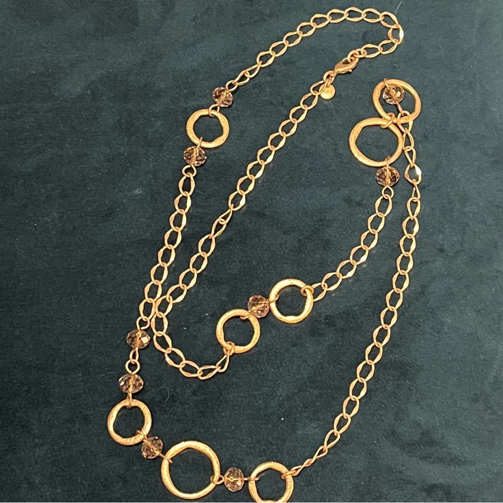Gold-Tone Long Rings and Chains Necklace with Amber Colored Beads.